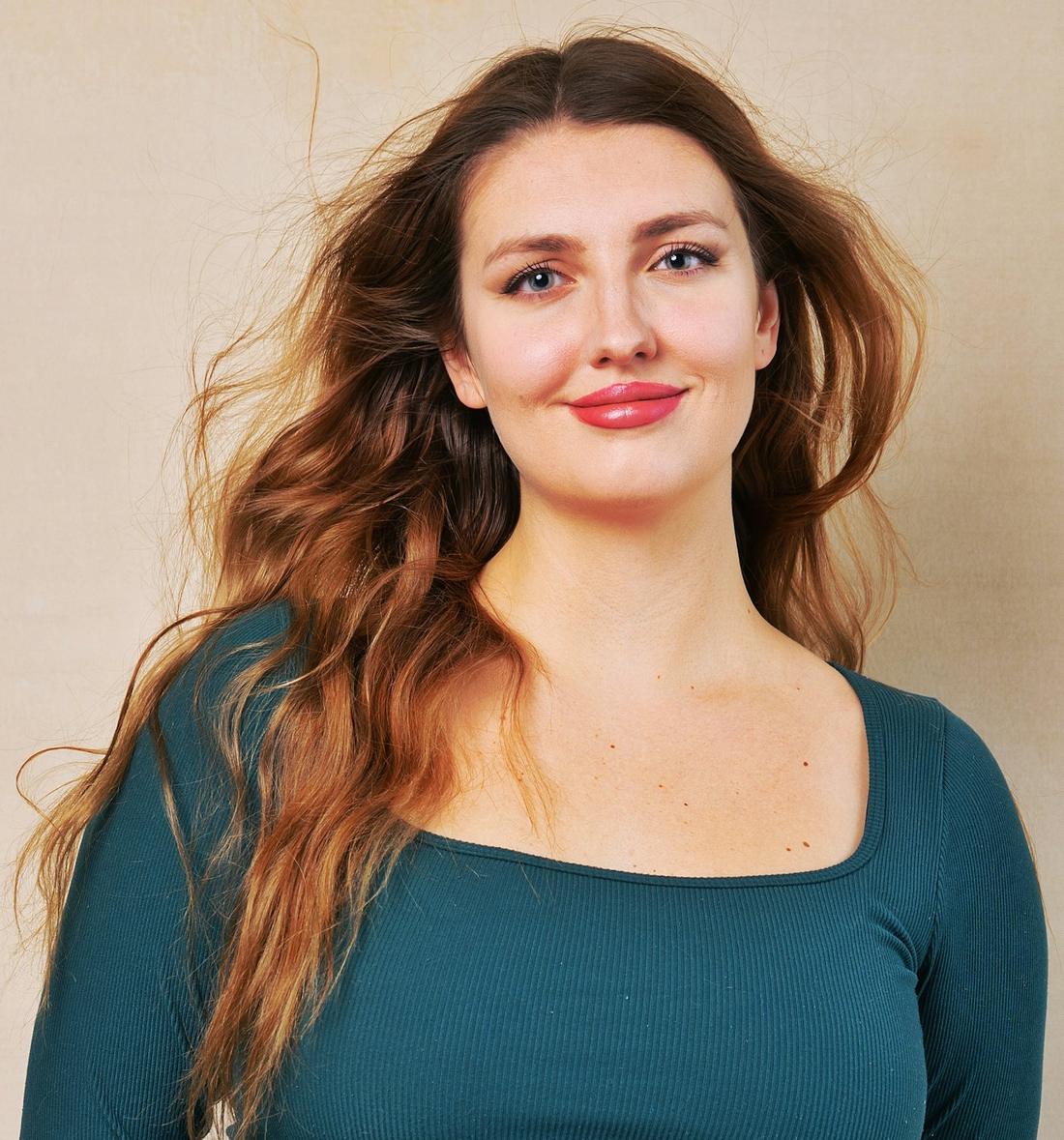 Woman with long, glossy wavy brown hair